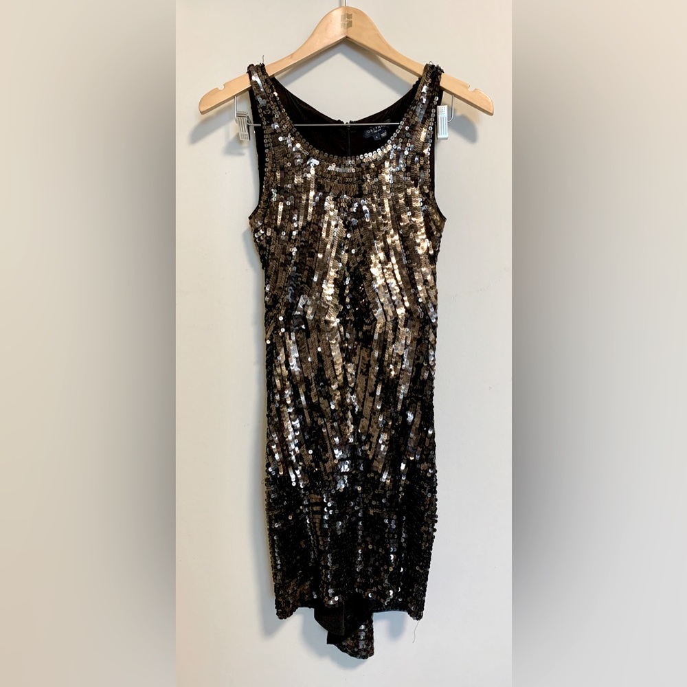 Black sequin dress with fish tail back.